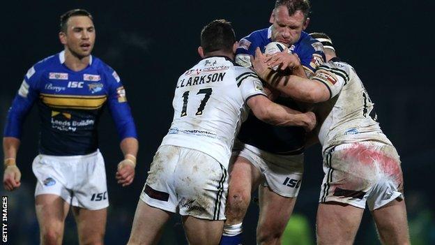 Jamie Peacock is held up by the Widnes defence