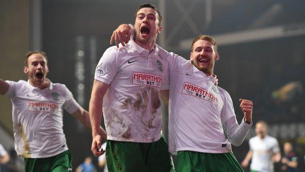 Lewis Stevenson celebrates in front of the Hibs fans after putting his side 2-0 ahead.