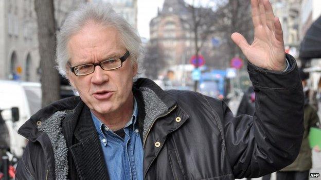 A photo taken on March, 11, 2010 shows Swedish cartoonist Lars Vilks walking in the streets of Stockholm. Vilks, known for his drawing of the Prophet Mohammed with the body of a dog in 2007 was attending a debate on Islam and free speech as gunmen opened fire on February 16, 2015 in Copenhagen