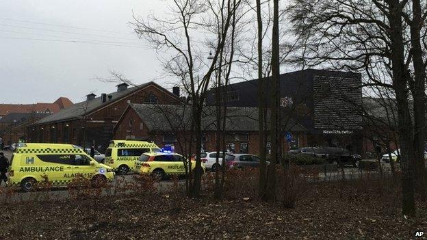 Emergency services gather outside a venue after shots were fired where an event titled "Art, blasphemy and the freedom of expression" was being held in Copenhagen, Saturday, Feb. 14, 2015