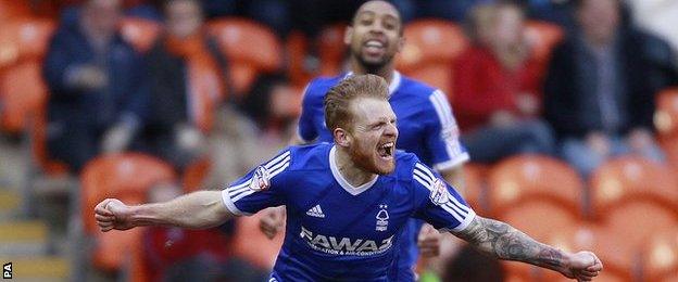 Chris Burke celebrates after scoring Forest's fourth goal