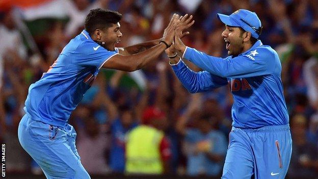 Umesh Yadav celebrates his second wicket of Pakistan"s Sohaib Maqsood