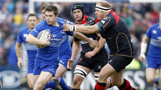 Leinster scrum-half Luke McGrath shrugs off the tackle of Brok Harris