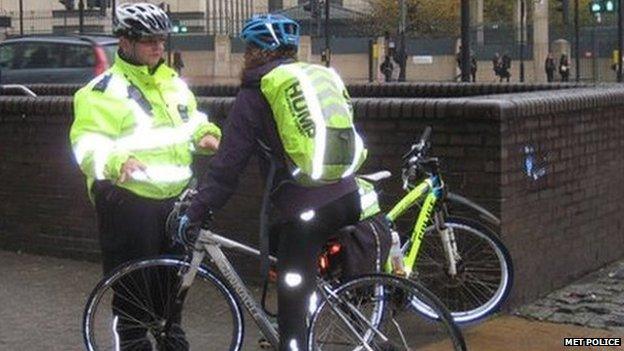 Met officer talks to cyclist at spot checks in Vauxhall last Monday