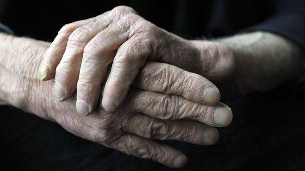 An elderly man's hands