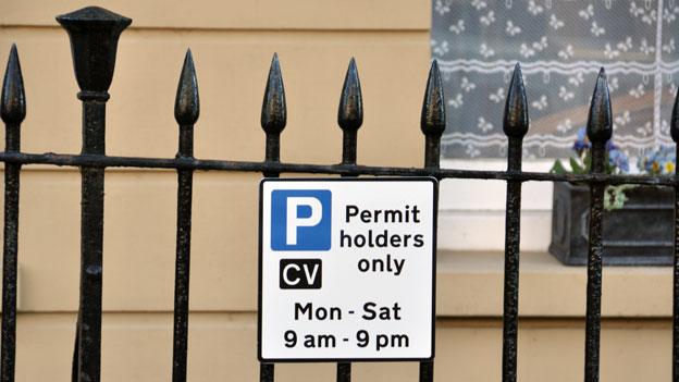 Signs on railings in Clifton Village