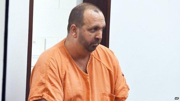 Craig Hicks enters the courtroom for his first appearance at the Durham County Detention Center (11 February 2015)