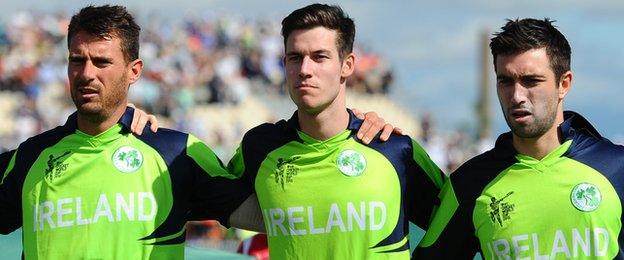 The Irish players stand shoulder to shoulder before the start of their game against the West Indies