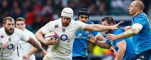 England's Dave Attwood hands off Sergio Parisse of Italy during the Six Nations match at Twickenham Stadium