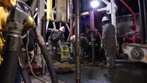 Oil workers at work