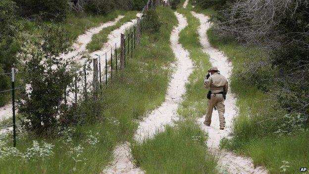 A U.S. Customs and Border Protection Air and Marine agent patrols the Texas-Mexico border near McAllen, Texas, on 5 September 2014