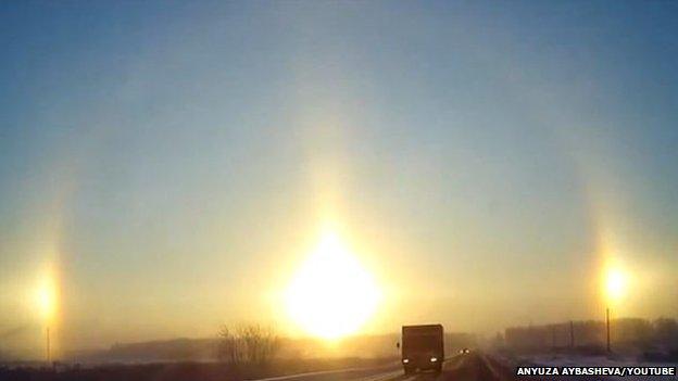 A view of the sunrise from a road