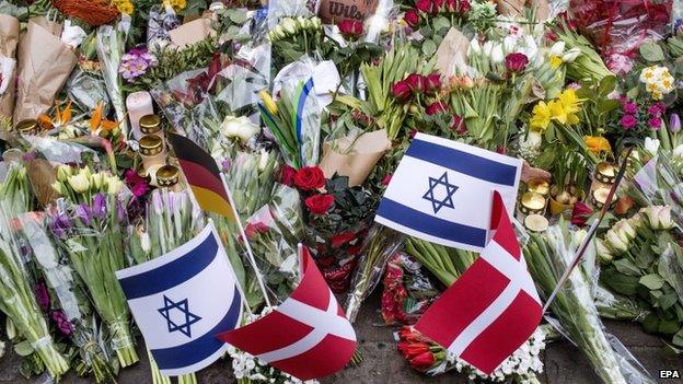 Floral tributes continue to grow in numbers in front of the synagogue following shootings in Copenhagen, Denmark, 16 February 2015