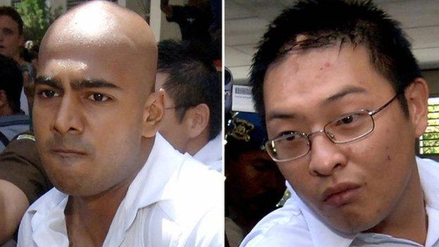 Myuran Sukumaran (L) and Andrew Chan (R) being escorted out of a court in Denpasar, on Bali island, 14 February 2006