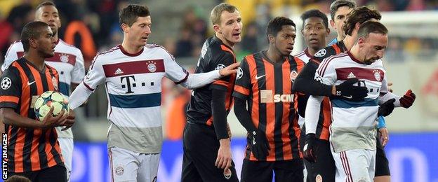 Franck Robery is led away by his Bayern team-mates