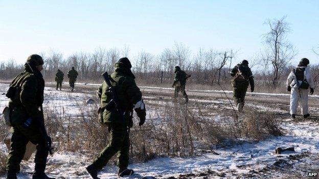 Pro-Russian rebels leave for a combat mission near the eastern Ukrainian city of Debaltseve, 17 Feb