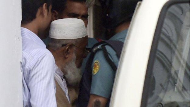 Abdus Subhan is taken into a van following his verdict at a special court in Dhaka on February 18