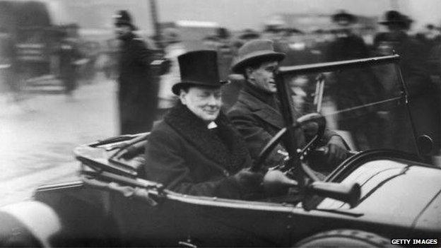 Winston Churchill arrives at the House of Commons for the Opening of Parliament at the wheel of his two-seater, November 1925