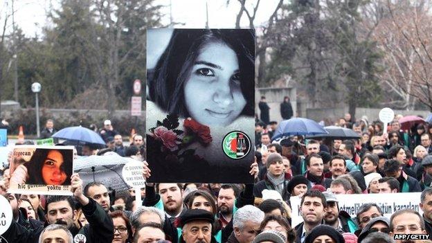 A Member of Turkey's Bar Associations holds a poster depicting slain Ozgecan Aslan, in Ankara, on 16 February 2015