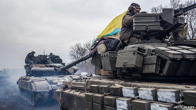 Ukrainian troops drive tanks out of Debaltseve. 19 Feb 2015