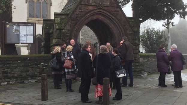 People begin to gather for the service at St Peter's Church, Carmarthen