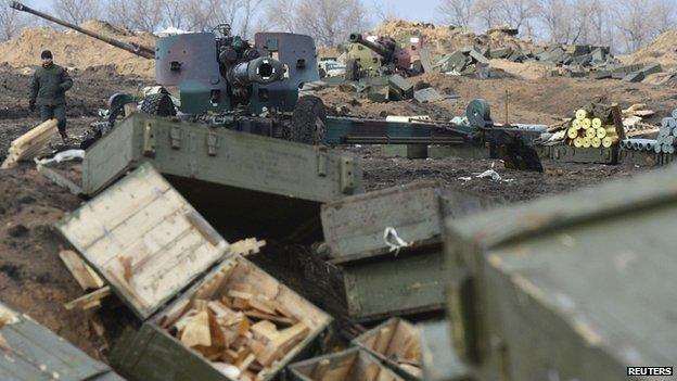 Ukrainian armed forces with shell boxes in the foreground in Donetsk region 20/02/2015