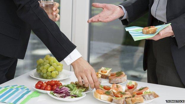 Businesspeople eating food