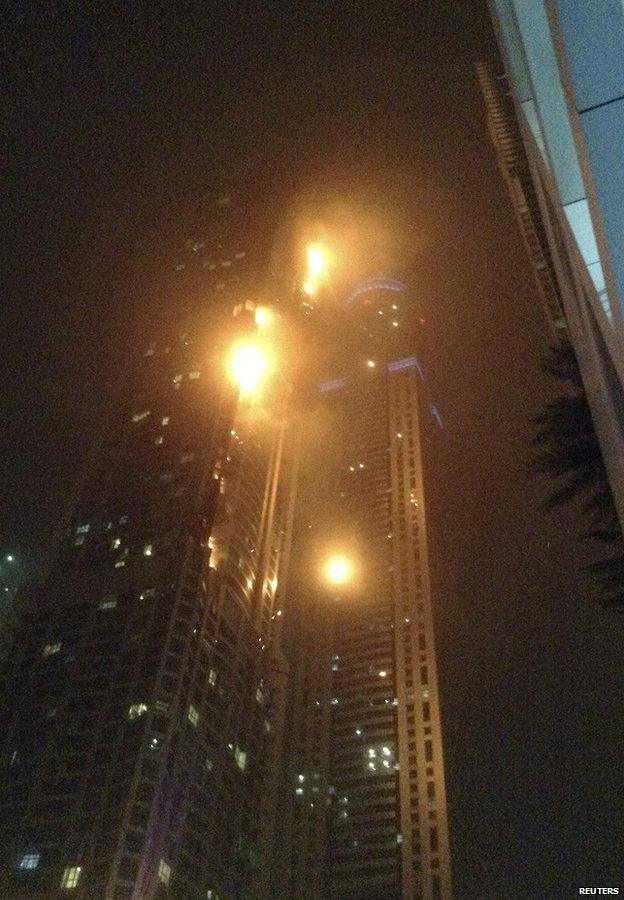 A fire blazes at "The Torch", a residential high-rise tower, in Dubai February 21, 2015