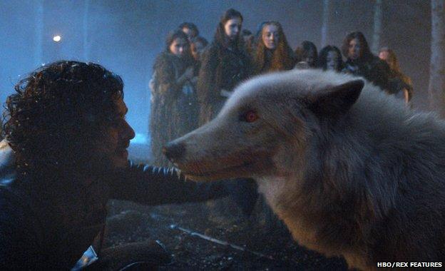 Kit Harrington as John Snow with Game of Thrones direwolf