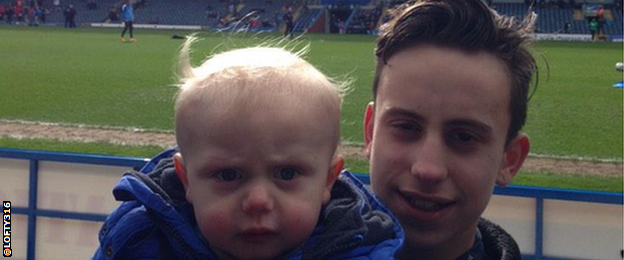 A child with his father at Ewood Park