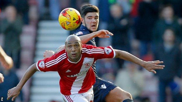 Alex Mowatt (top) challenges with Emilio Nsue