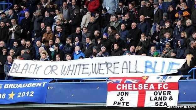 Chelsea fans holding a banner promoting equality at Stamford Bridge