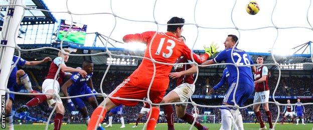 Burnley defender Ben Mee earns his side a point as he scores a header at Chelsea