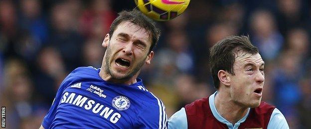 Chelsea defender Branislav Ivanovic (left) was unhappy with Ashley Barnes' challenge