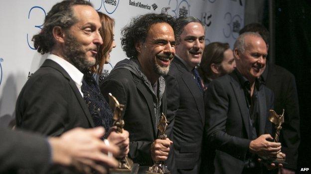 Alejandro G Inarritu (centre) with Independent Spirit award for Birdman