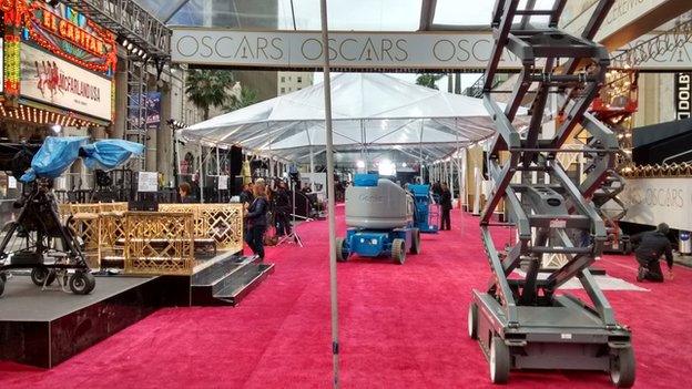 The Oscars red carpet - seen a day before the event with staff putting the surrounding structures together