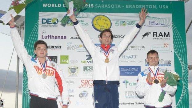 Britain's Jamie Cooke (centre) after winning gold at the Sarasota Modern Pentathlon World Cup