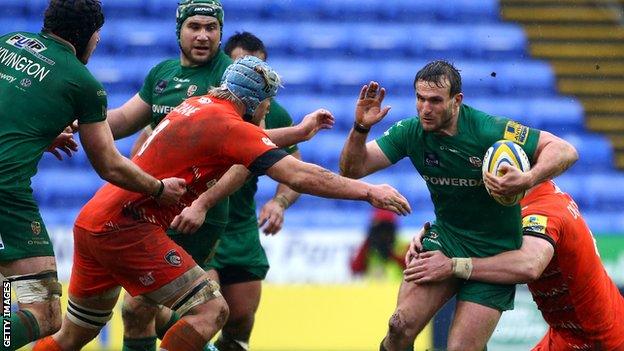 Andrew Fenby (r) takes on the Leicester defence