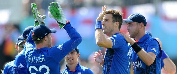 Steven Finn (second from left) celebrates taking a wicket with team-mates