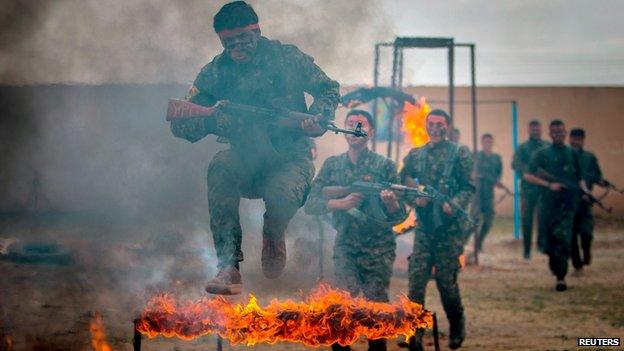 YPG fighters at a training camp in Ras al-Ain, Syria