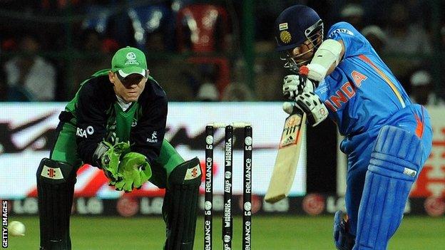 Niall O'Brien and Sachin Tendulkar in action during the 2011 World Cup match between India and Ireland in Bangalore