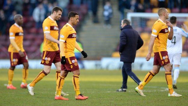 Dejected Motherwell players following the defeat to Dundee.