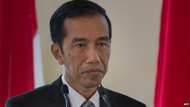 Indonesia's President Joko Widodo listens as Malaysian Prime Minister Najib Razak (unseen) speaks during a joint press conference at the prime minister's office in Putrajaya, outside Kuala Lumpur on February 6, 2015.