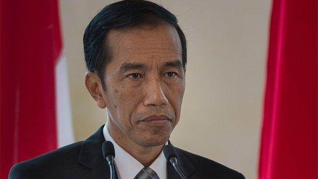 Indonesia's President Joko Widodo listens as Malaysian Prime Minister Najib Razak (unseen) speaks during a joint press conference at the prime minister's office in Putrajaya, outside Kuala Lumpur on February 6, 2015.