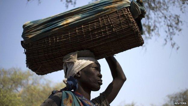 Mother carries her child to hospital in a basket