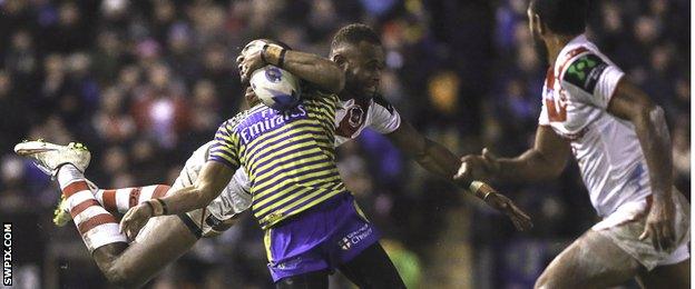 Warrington's Kevin Penny is tackled by St George's Eto Nabuli
