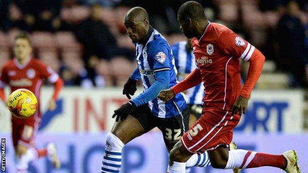 Wigan's Marc-Antoine Fortune battles with Cardiff's Bruno Ecuele Manga