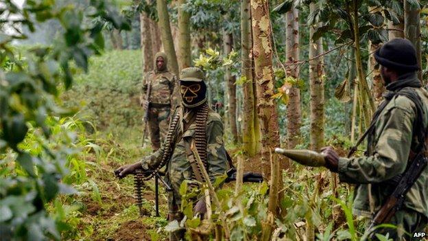 Democratic Republic of Congo regular army soldiers stand guard in the Nakabumbi area of Kimbumba, 20kms from Goma, near the border with Rwanda, on June 14, 201