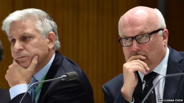 Attorney-General Secretary Chris Moraitis (left) and Attorney-General George Brandis react during a Senate Estimates hearing at Parliament House in Canberra, Tuesday, 24 February 2015.