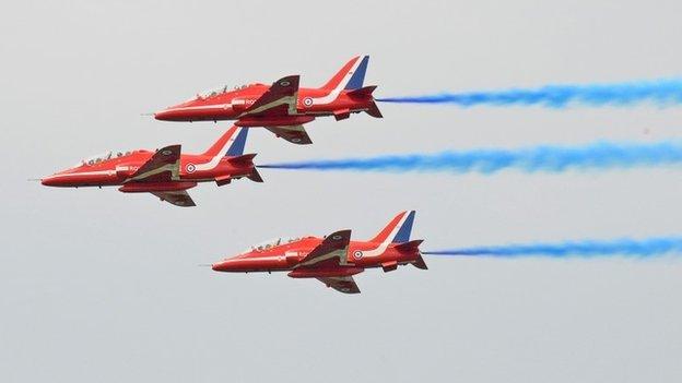 Three Red Arrows jets with former three-stripe livery